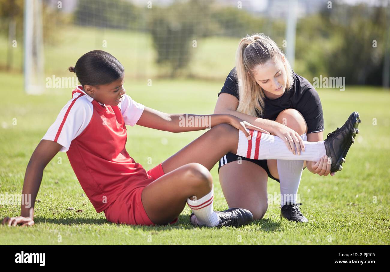Soccer, sports and injury of a female player suffering with sore leg ...