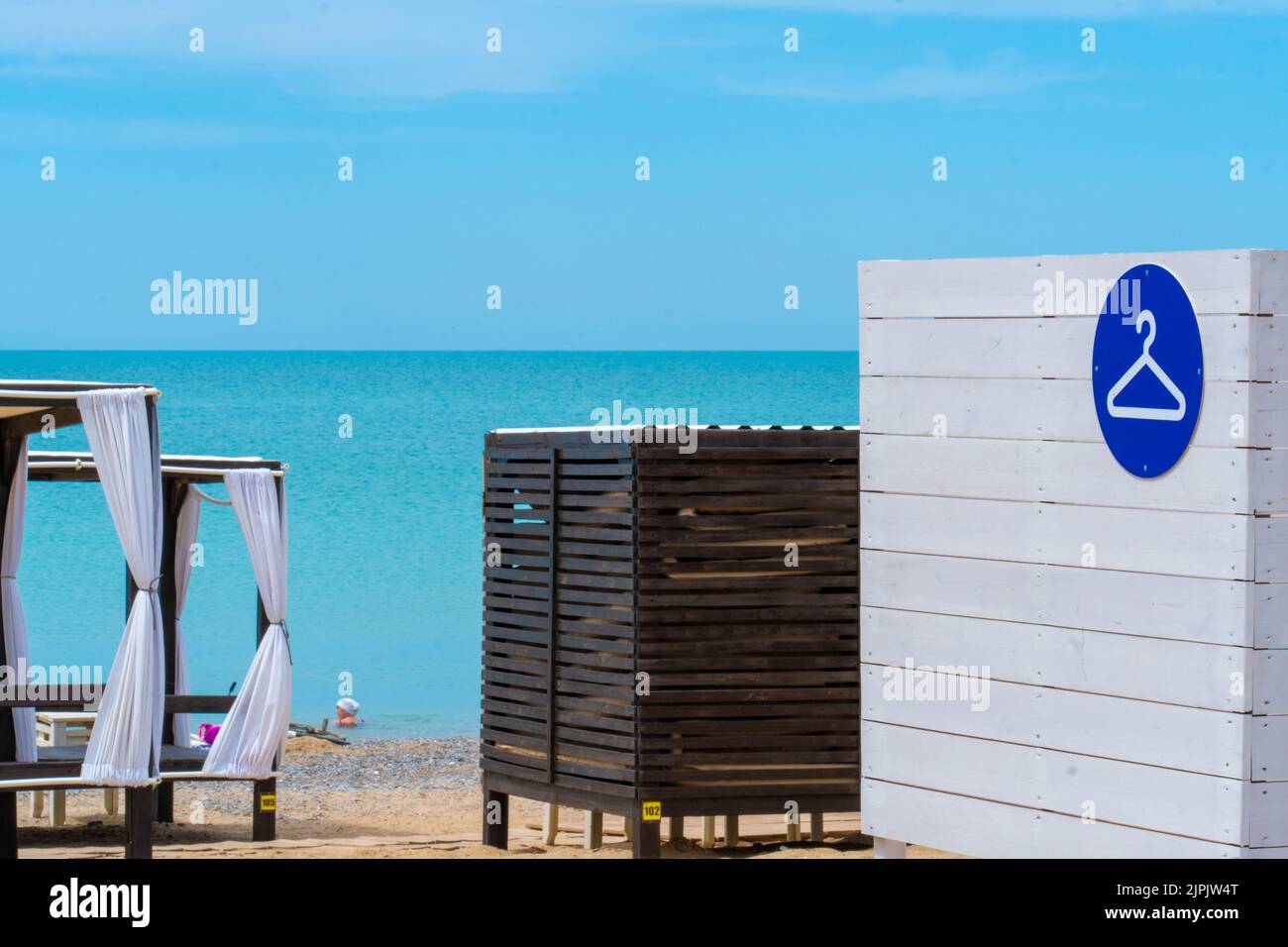 Room sea sign changing beach outdoors summer nobody travel coast, concept wall resort from sunlight from backgrounds cabin, dressing man. Nature Stock Photo