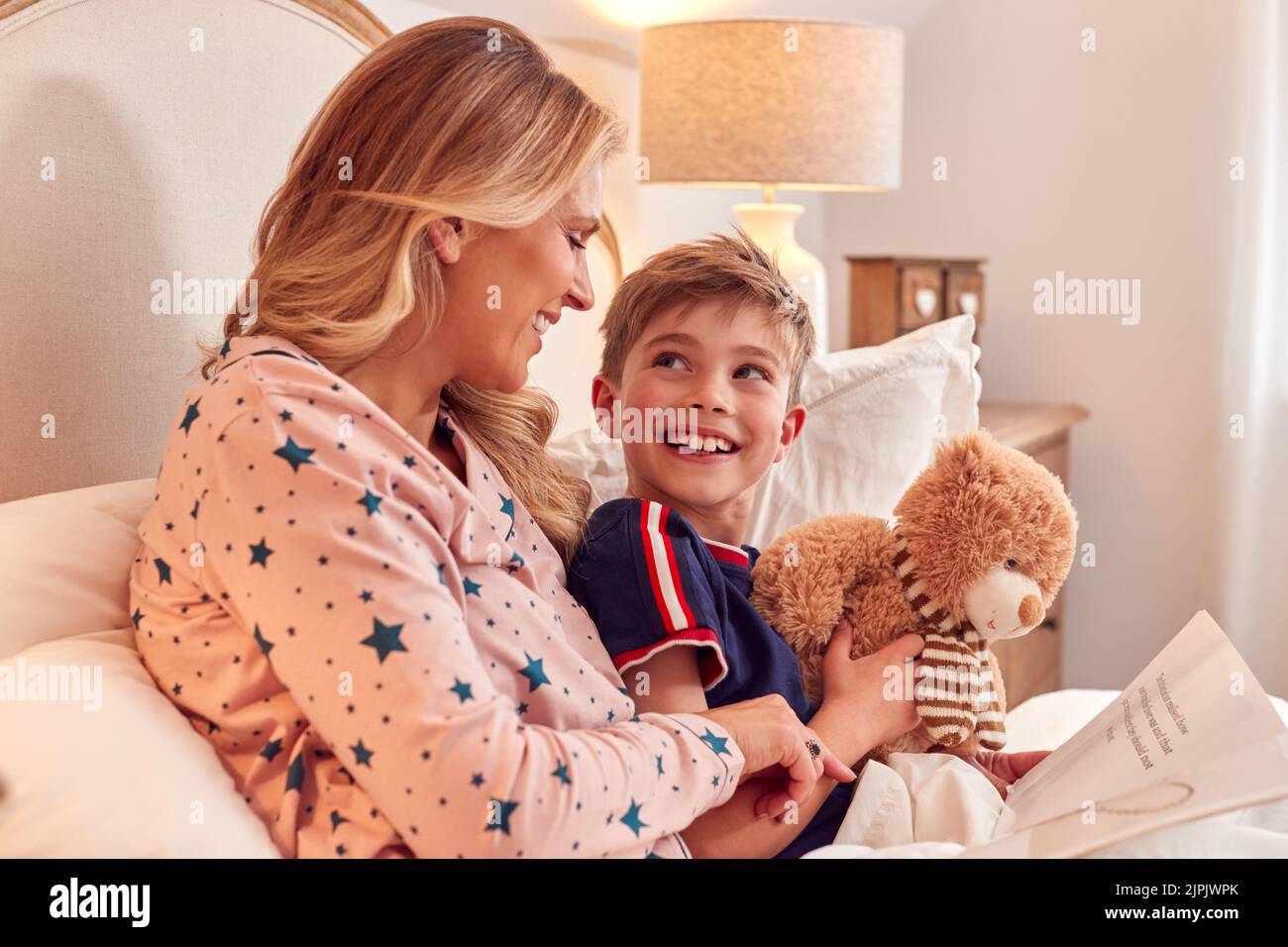 mother, smiling, son, bedtime story, mom, mothers, mum, smile, sons Stock Photo Alamy