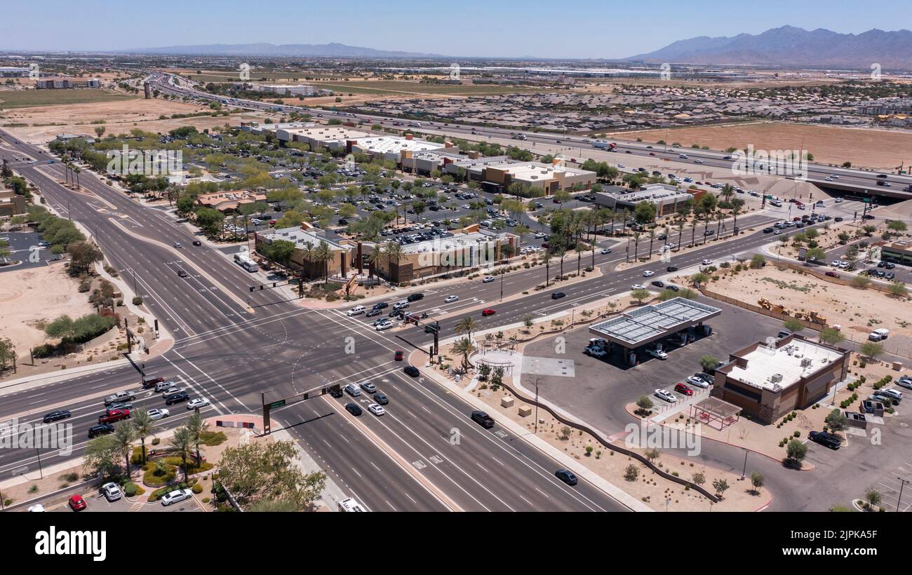 Afternoon aerial view of new shopping mall sprawl and empty lots of
