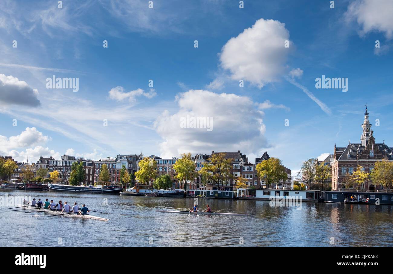 Crewing along the Amstel River in early Autumn, Amsterdam, Netherlands Stock Photo