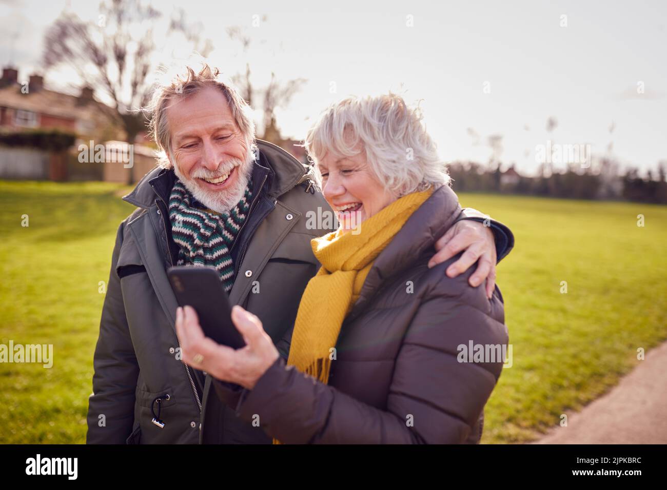 walk, sms, smart phone, older couple, walks, smart phones, smartphone, smartphones, older couples Stock Photo