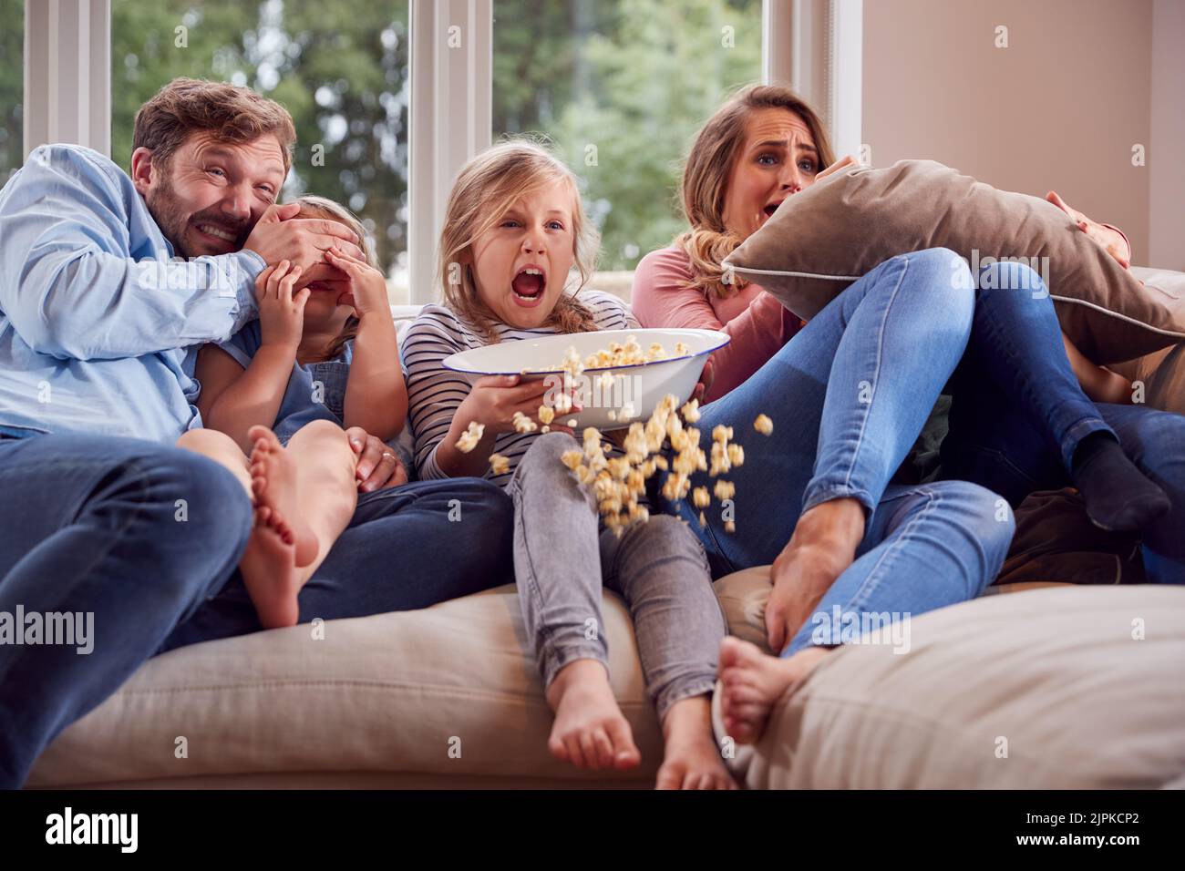 watching tv, frighten, popcorn, family life, scary, television, tv, frights, popcorns, family lifes, scaries Stock Photo
