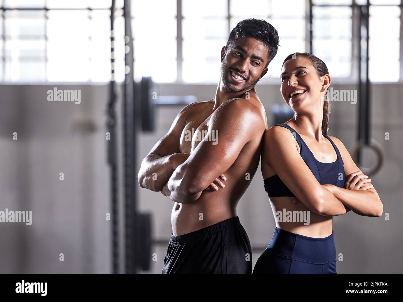 Team, gym and fitness couple doing exercise workout and living a healthy, wellness and athletic lifestyle together. Happy, energy and strong friends Stock Photo