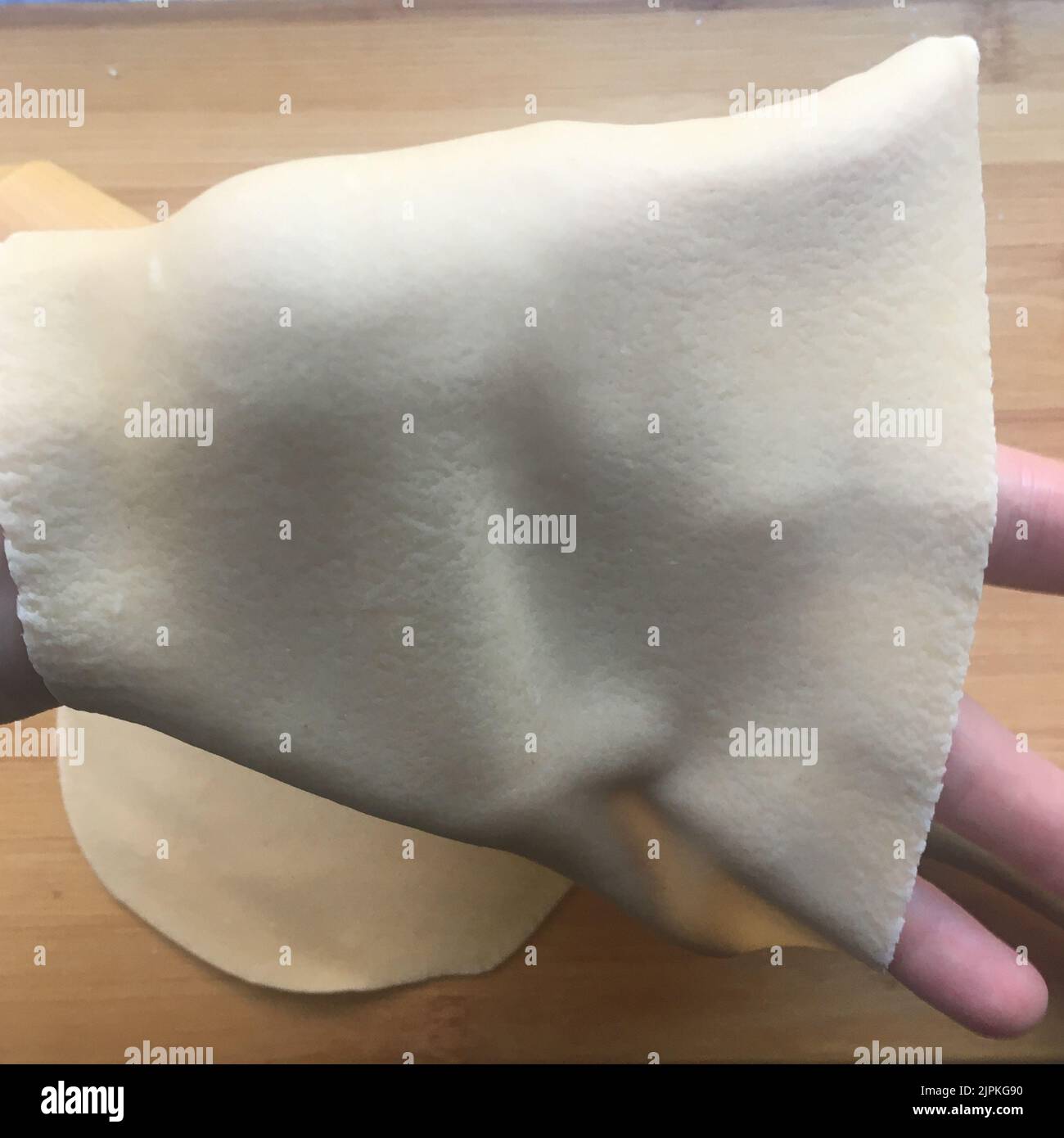 transparent lasagna sheet on a hand Stock Photo