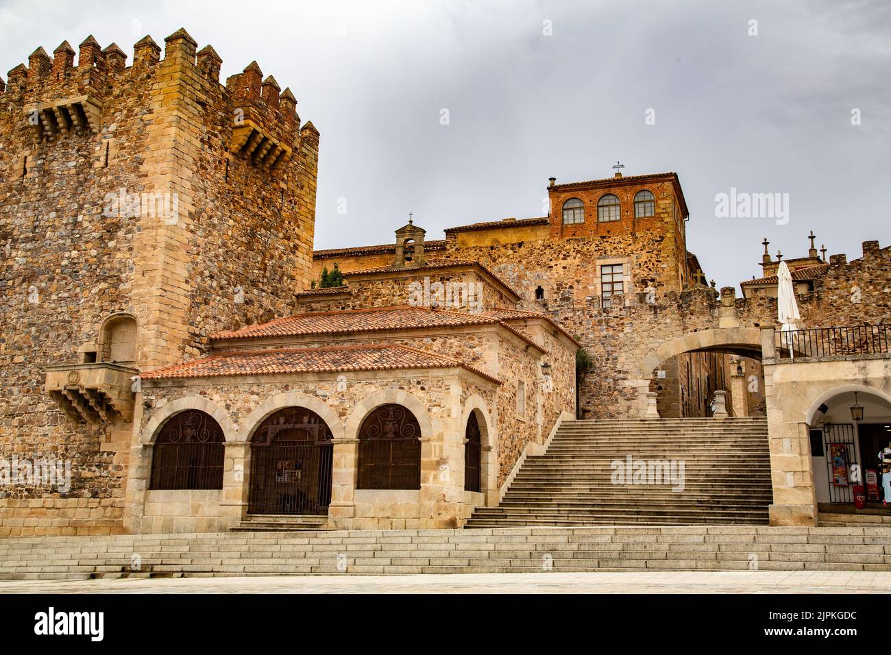 Staircase and square with large arch and round arched buildings Stock Photo