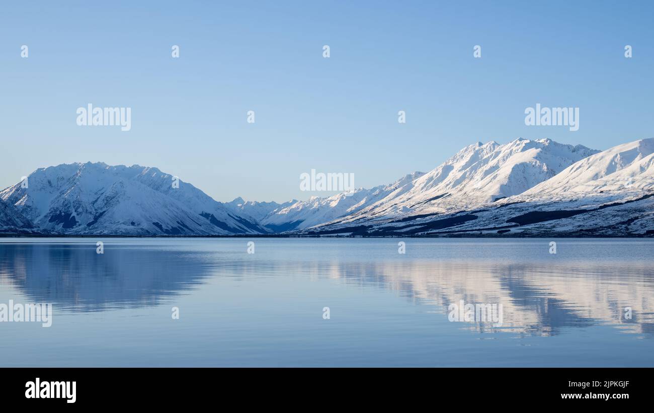 Ben Ohau range reflected in clear water of Lake Ohau, Twizel, South ...