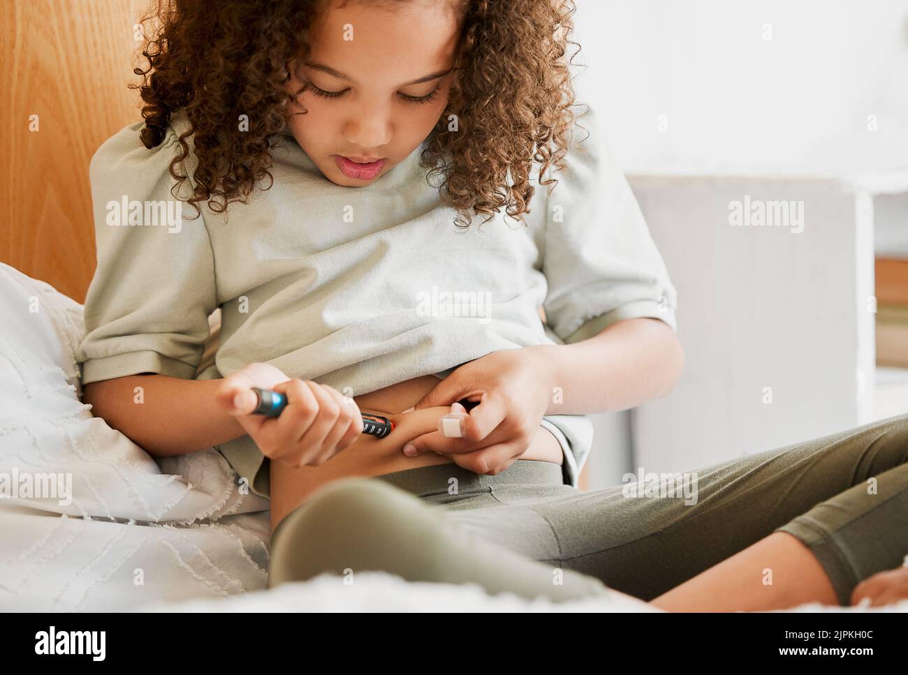 Diabetes, insulin and diabetic girl injecting treatment in her bedroom