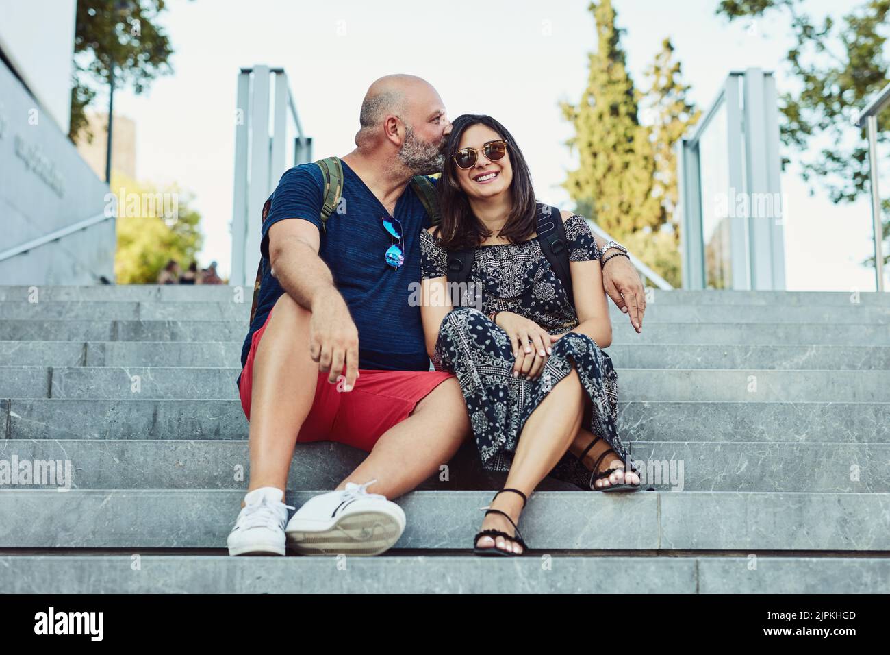 I love seeing new places with you. an affectionate couple spending time together outdoors. Stock Photo