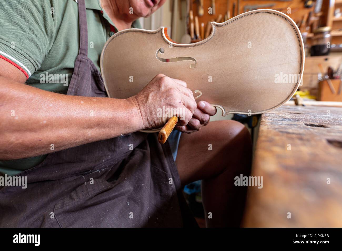 violinmaker at work in his italian workshop Stock Photo