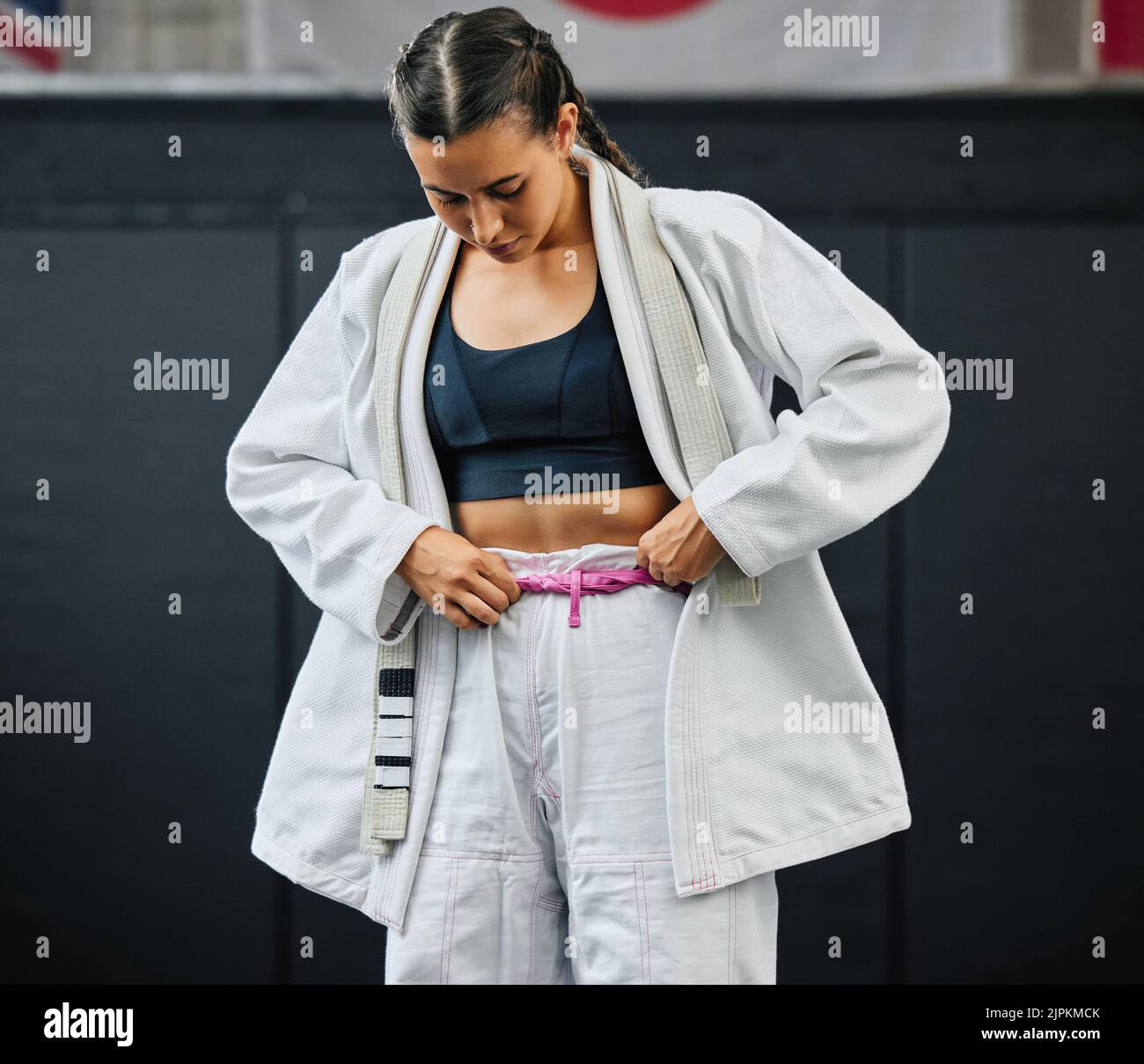 . Karate woman ready for fitness workout at gym, learning at a sport club and doing training exercise at a wellness school or studio. Female dojo Stock Photo