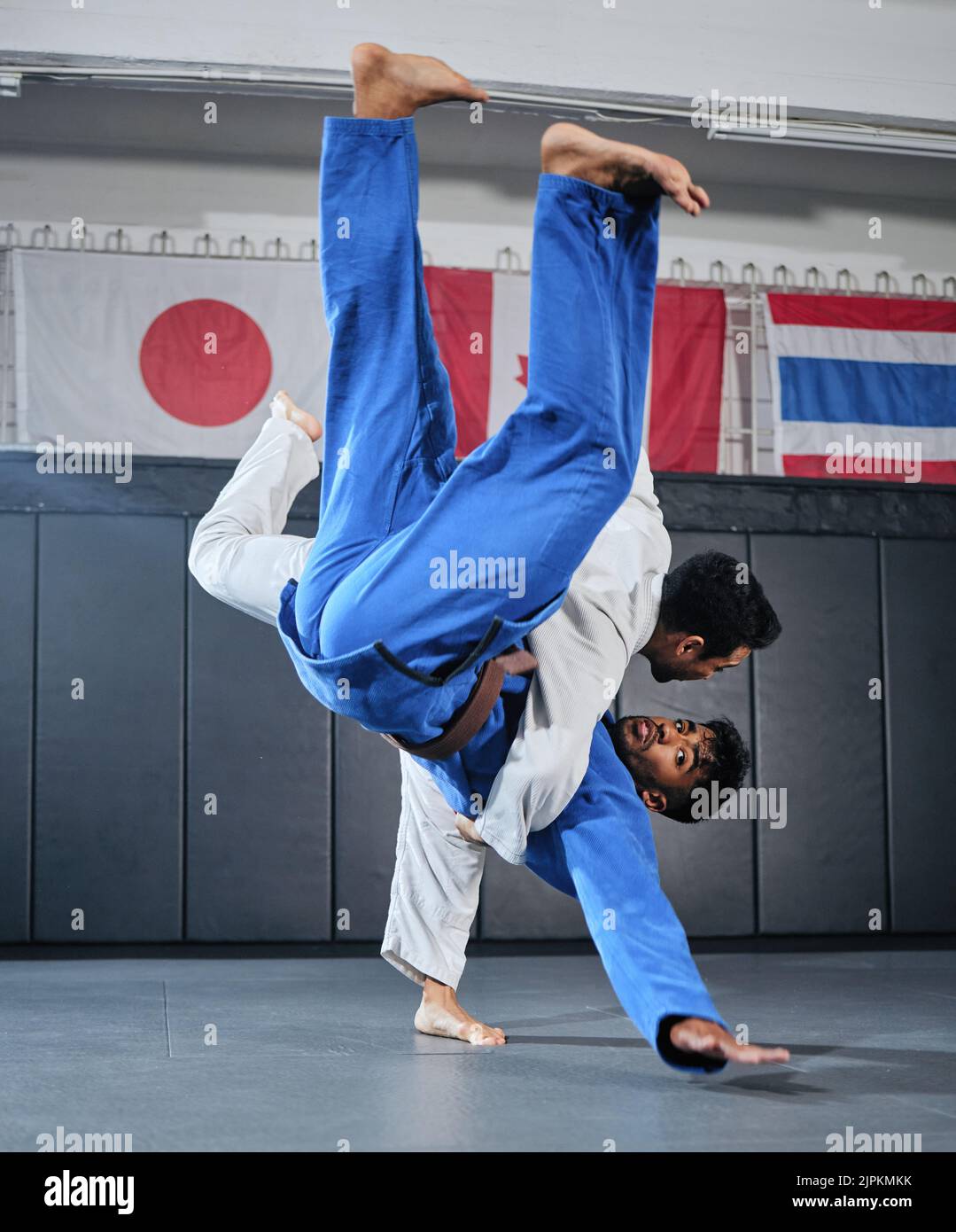 Health, fitness and motivation, men in karate fight for a winner in a dojo. Martial arts, a learning exercise to overcome, fight failure and beat the Stock Photo