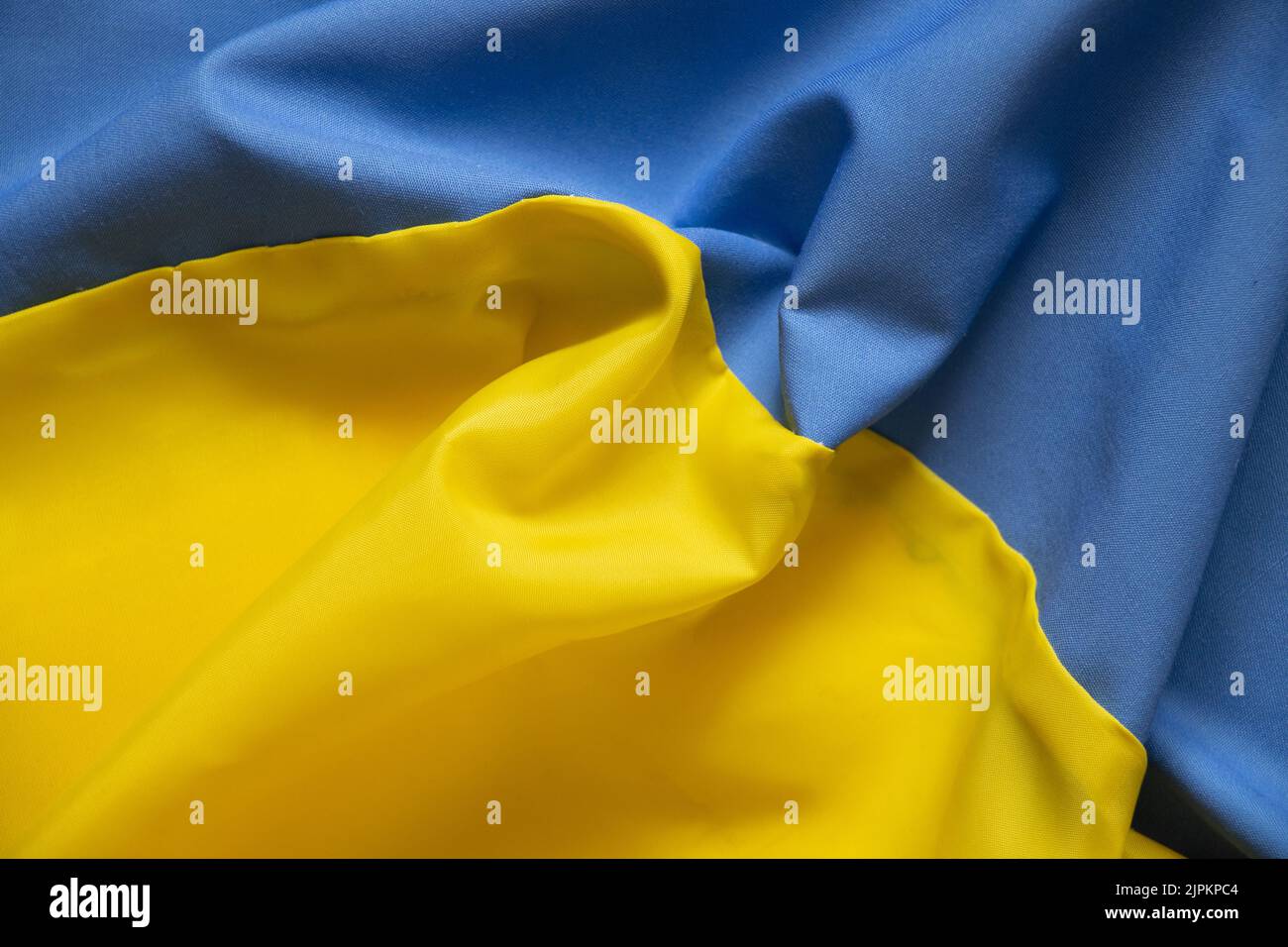 Yellow-blue national flag of Ukraine as a background, stop war and