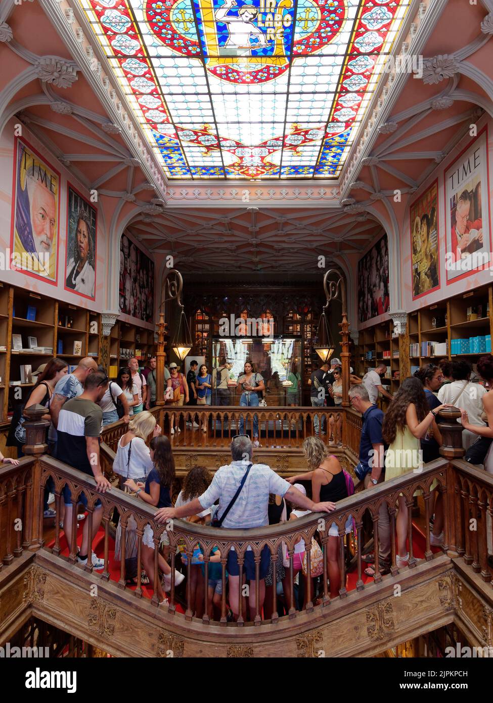 Interior of the beautiful Livraria Lello aka Lello Bookstore in Porto, Portugal. Stained glass windows and Time Magazine covers are on the walls. Stock Photo