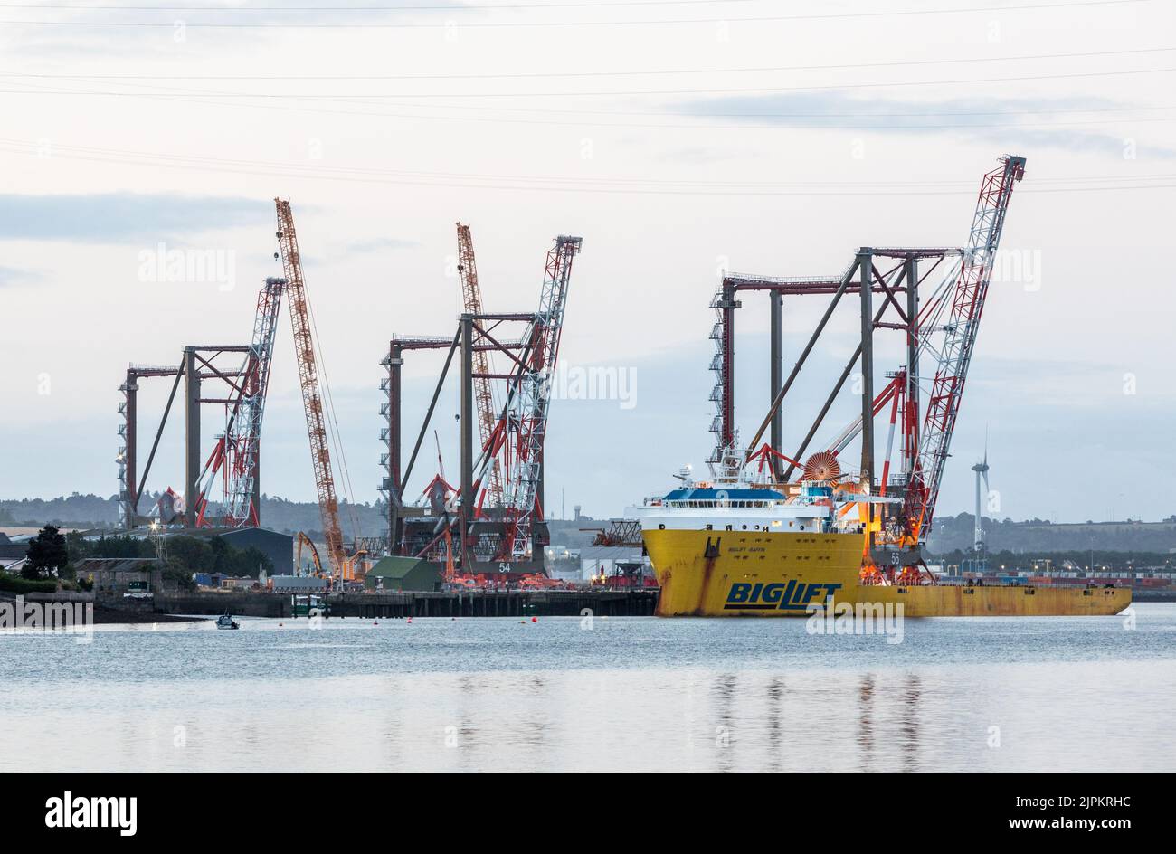 Rushbrooke, Cork, Ireland. 19th August, 2022. The first of three ship to shore container cranes is  loaded on to the deck of the ship Biglift Baffin at Cork Dockyard, Rushbrooke, Co. Cork, Ireland. Built by Liebherr in Killarney the cranes are the largest single objects ever engineered in Ireland to be shipped out of the country to dockyards in New York and New Jersey. Credit; David Creedon / Alamy Live News Stock Photo