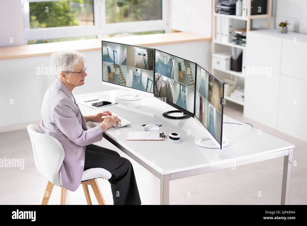 CCTV Security Footage On Multiple Computer Monitors Stock Photo