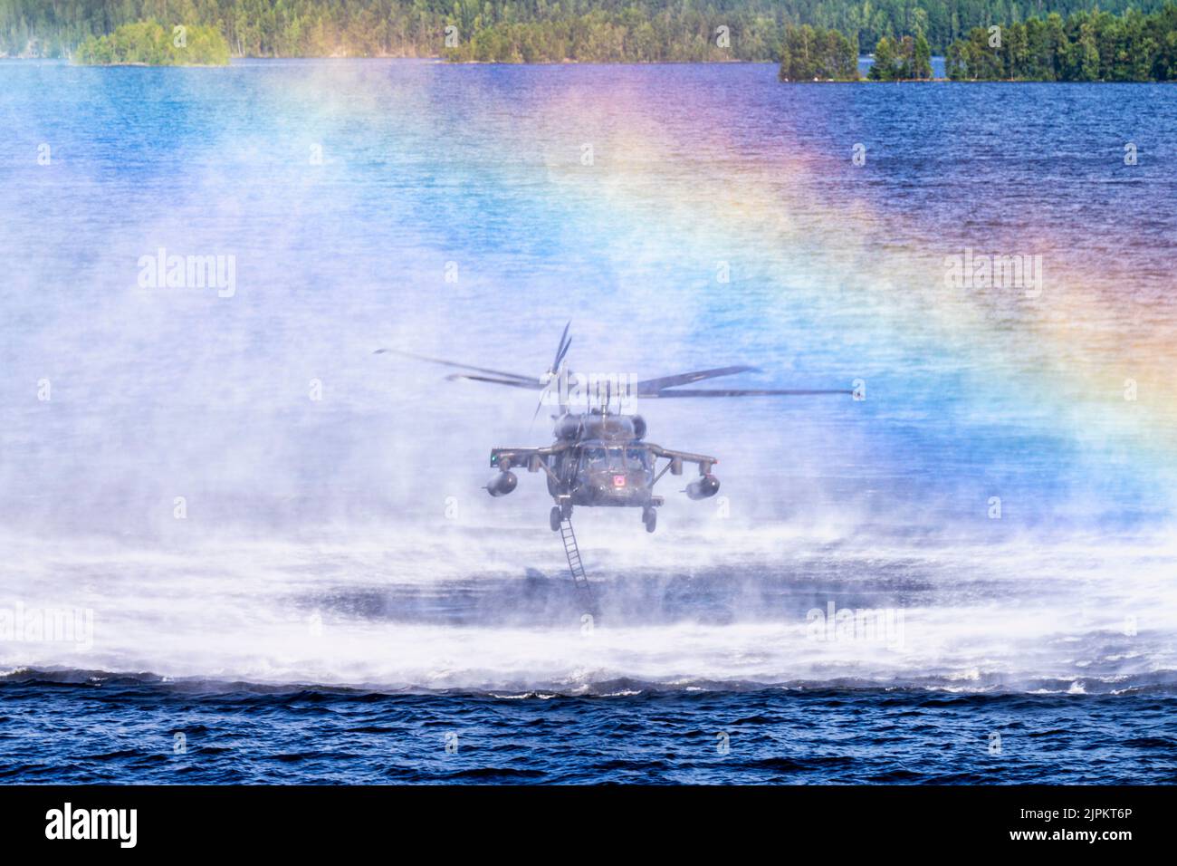 Tampere, Finland. 4th Aug, 2022. A U.S. Army UH-60 Black Hawk helicopter assigned to the 1st Squadron, 214th General Support Aviation Battalion, 12th Combat Aviation Brigade, conducts overwater training at Tampere, Finland, Aug. 4, 2022. 12th Combat Aviation Brigade is one of the units to support U.S. European Command theater strategy by demonstrating U.S. commitment to European Allies and Partners and highlighting U.S. capabilities to diverse audiences. 12 CAB is among other units assigned to V Corps, America's Forward Deployed Corps in Europe. They work alongside NATO Allies and regional Stock Photo
