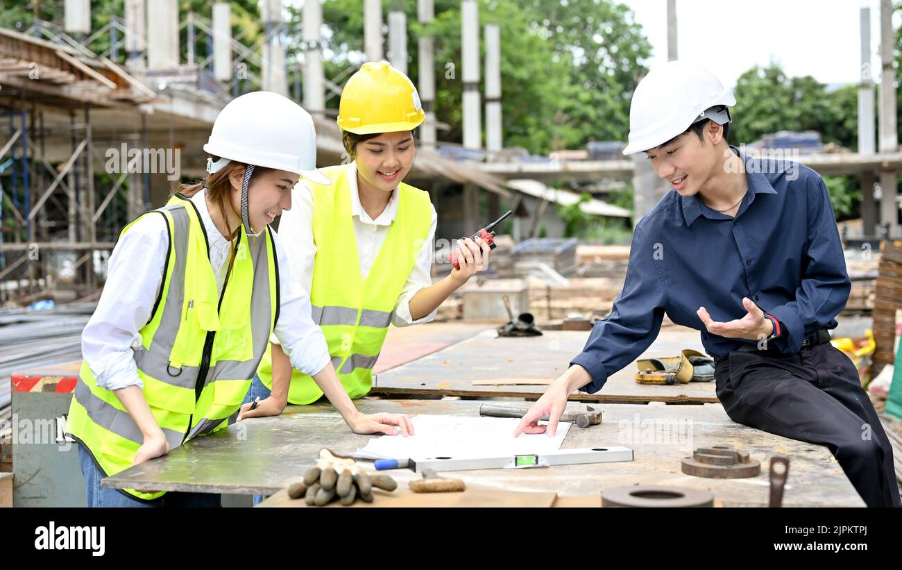 Engineer Civil Process Team of professional Asian civil engineer looking at the blueprint and ...