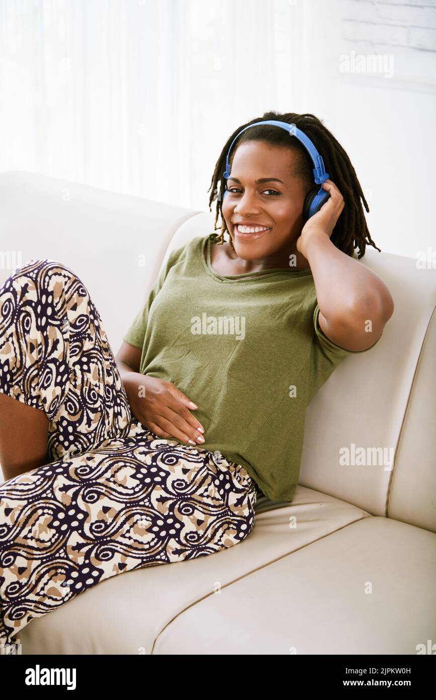 Smiling pretty woman enjoying music in her headphones Stock Photo