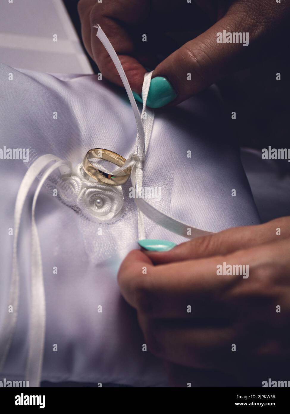 Wedding rings on pillow Stock Photo - Alamy