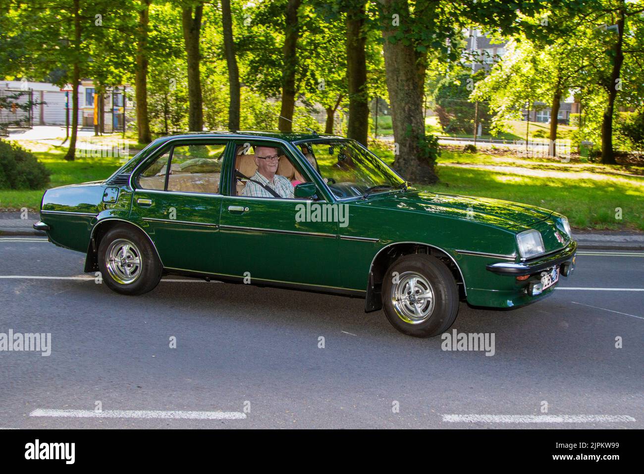 70s seventies Green Vauxhall Cavalier 4dr British classic car arriving at The annual Stanley Park Classic Car Show in the Italian Gardens. Stanley Park classics yesteryear Motor Show Hosted By Blackpool Vintage Vehicle Preservation Group, UK. Stock Photo