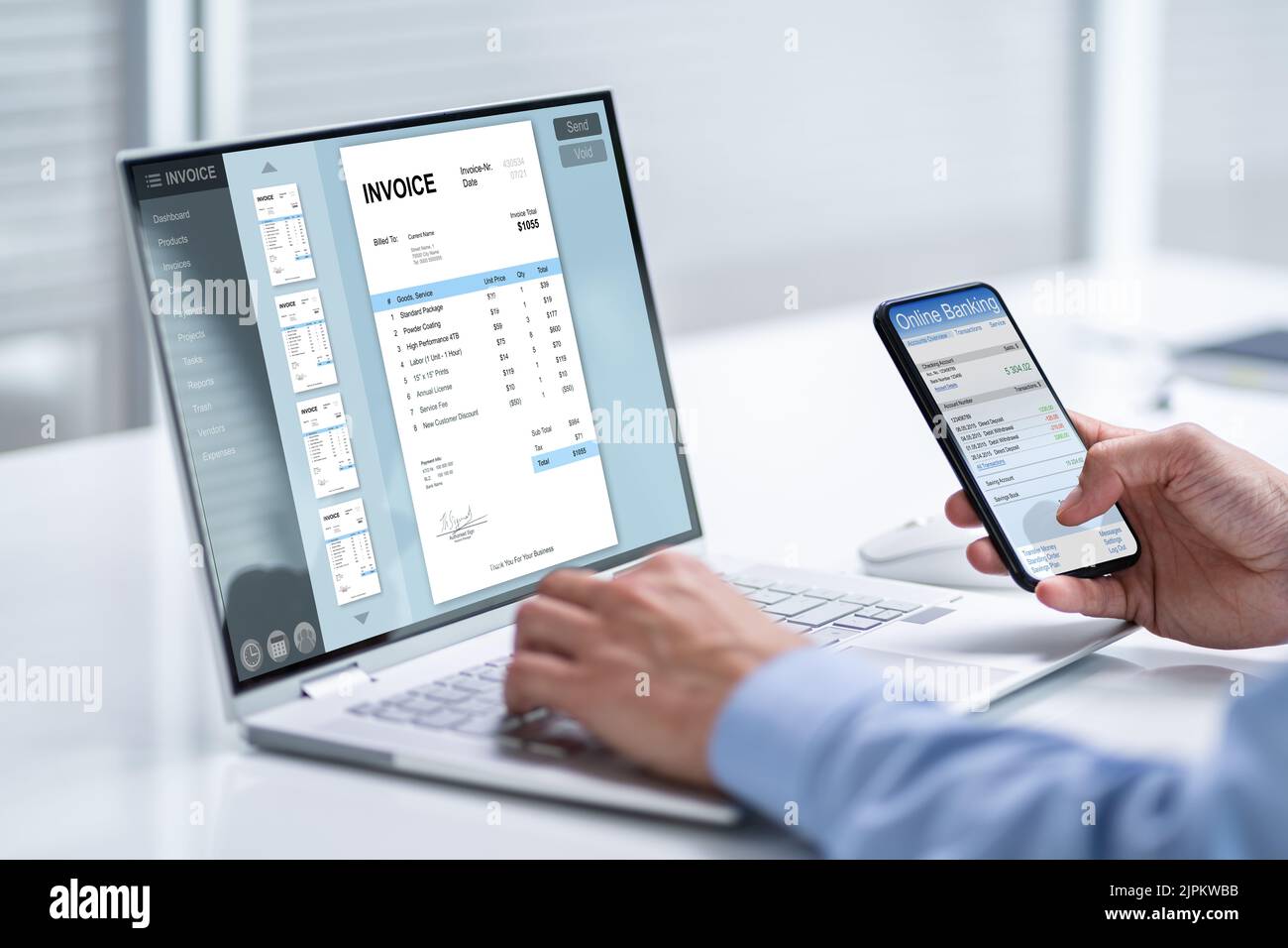 Young Businessman Looking At Invoice While Doing Online Banking On Phone Stock Photo