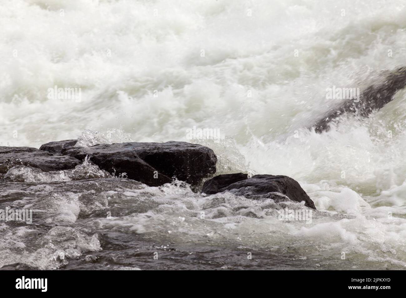 The Cascades of water in the big river. Powerful stream down the valley