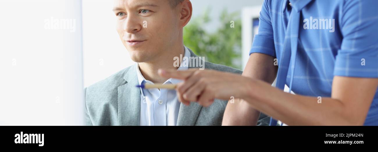 Two business persons are working on project together Stock Photo