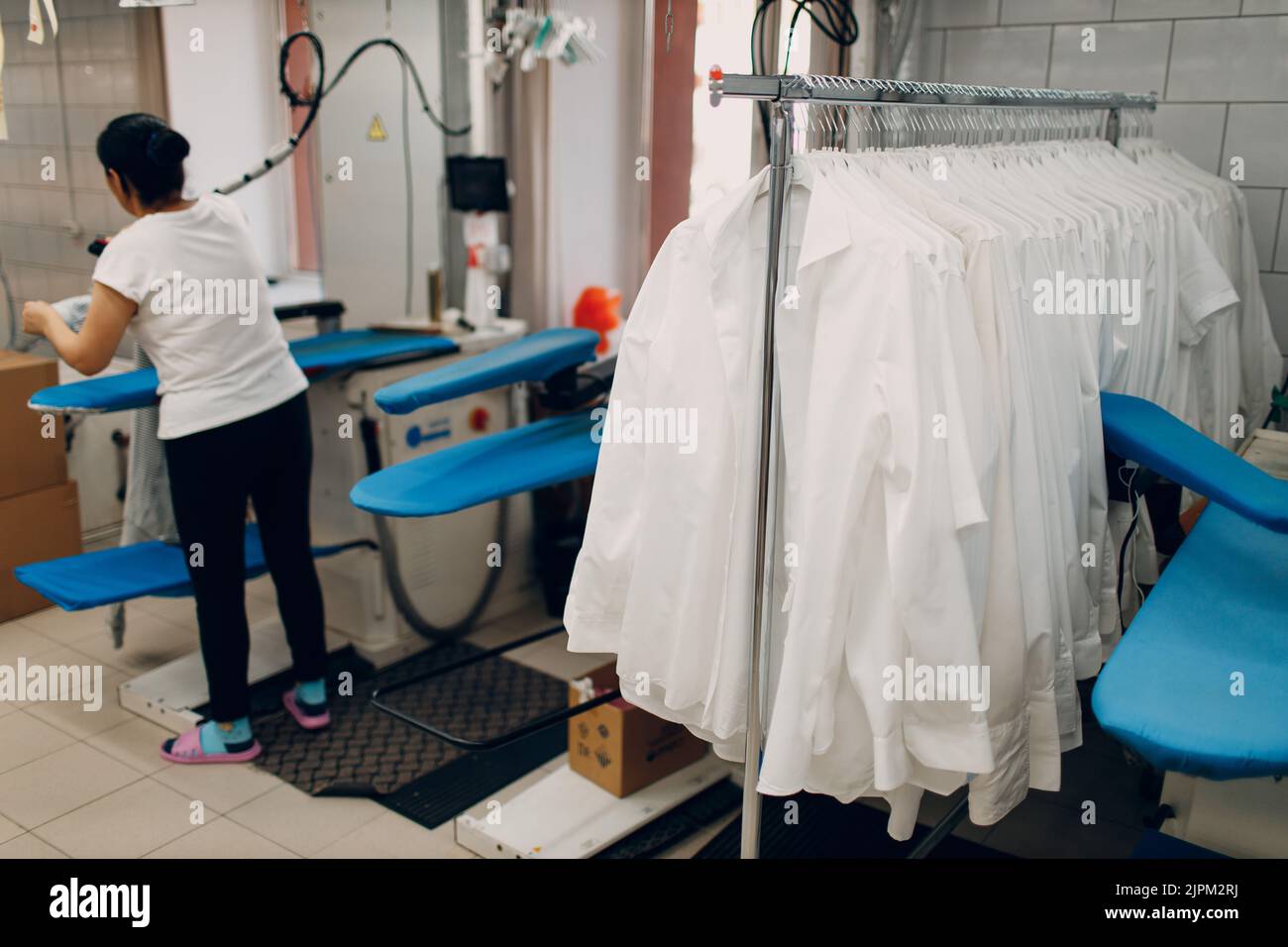 Dry cleaning shirts clothes. Clean cloth chemical process. Laundry