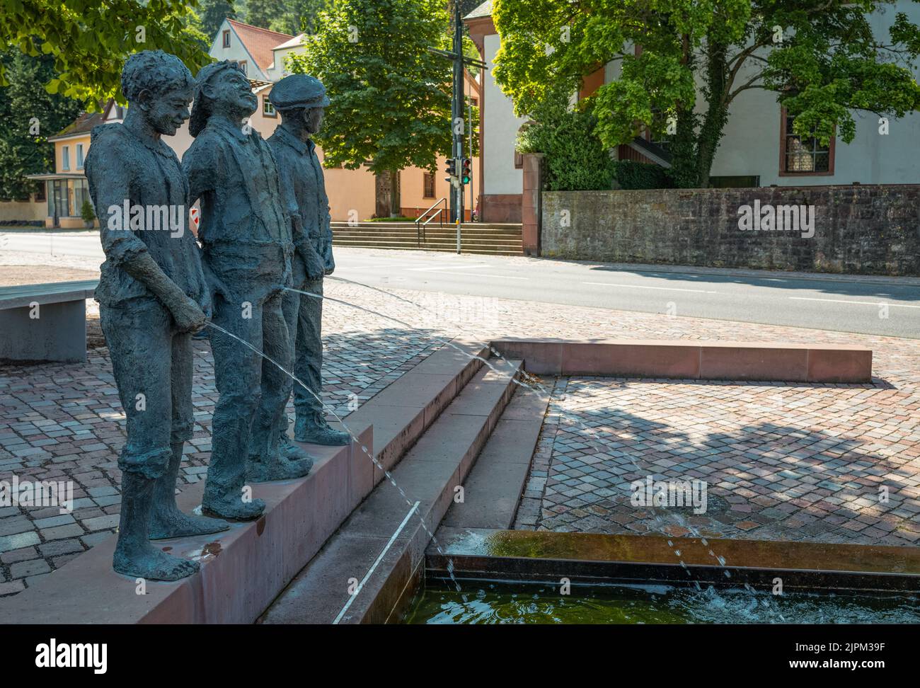 Miltenberg, Germany - July 18, 2021: A sculptural group of boys peeing (Pisslers Fountain), in the old town Stock Photo