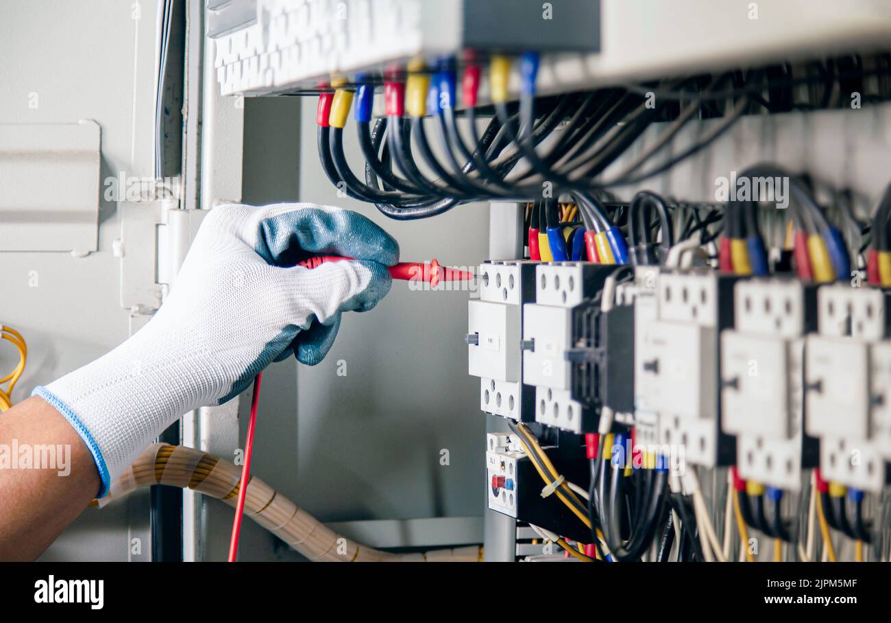 Electrical engineer checking the operation of electrical control