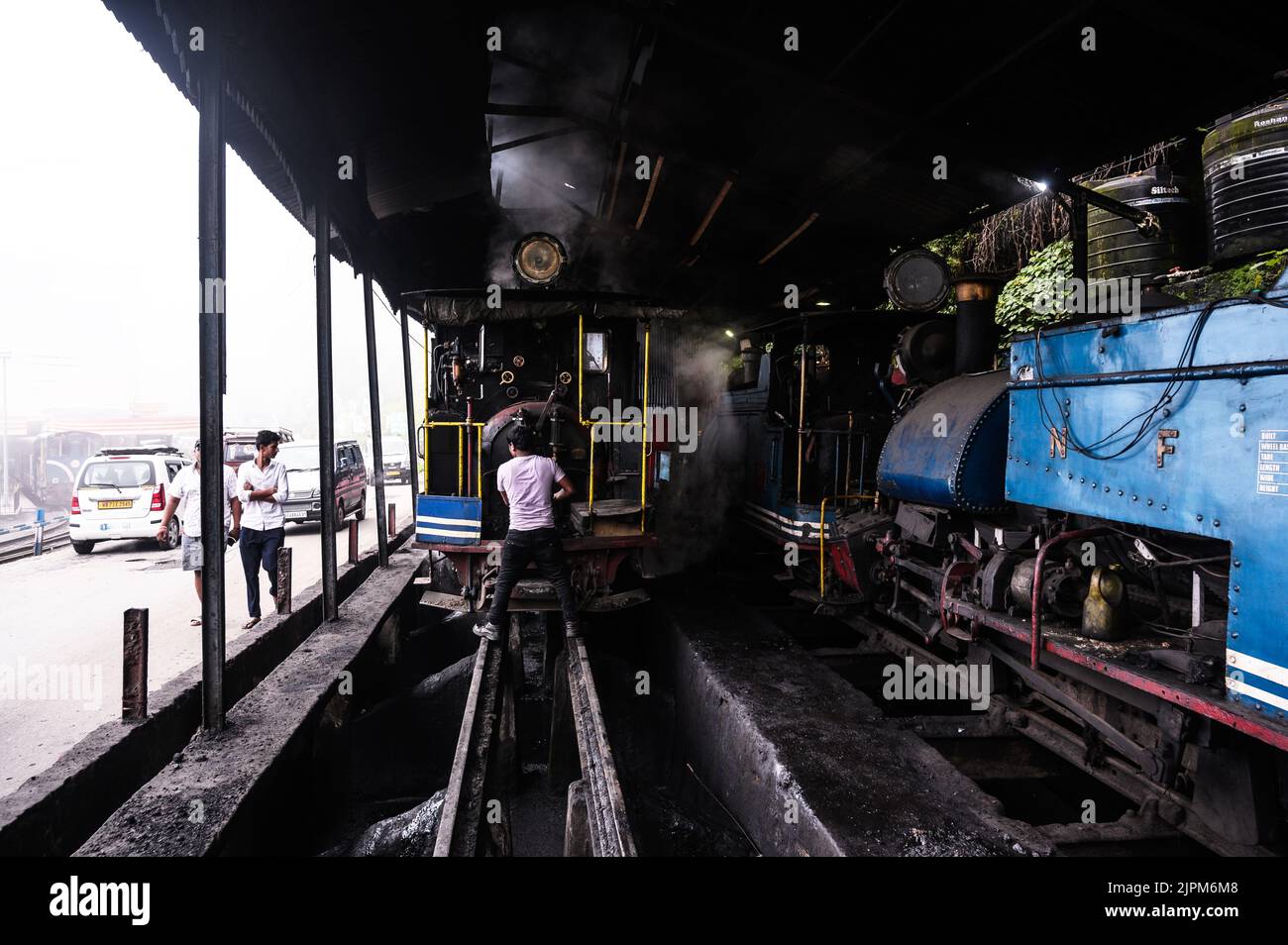 The Darjeeling Himalayan Railway, a UNESCO World Heritage Site,  also known as the DHR or the Toy Train, is a 610 mm gauge railway that runs between New Jalpaiguri and Darjeeling in the Indian state of West Bengal. It climbs from about 100 m above sea level at New Jalpaiguri to about 2,200 m (7,200 ft) at Darjeeling, using six zig zags and five loops to gain altitude. Six diesel locomotives handle most of the scheduled service, with daily tourist trains from Darjeeling to Ghum – India's highest railway station – and the steam-hauled Red Panda service from Darjeeling to Kurseong. Stock Photo