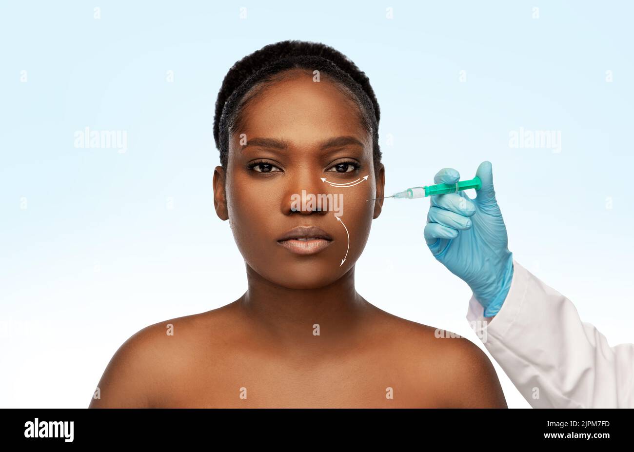 woman and plastic surgeon's hand with syringe Stock Photo
