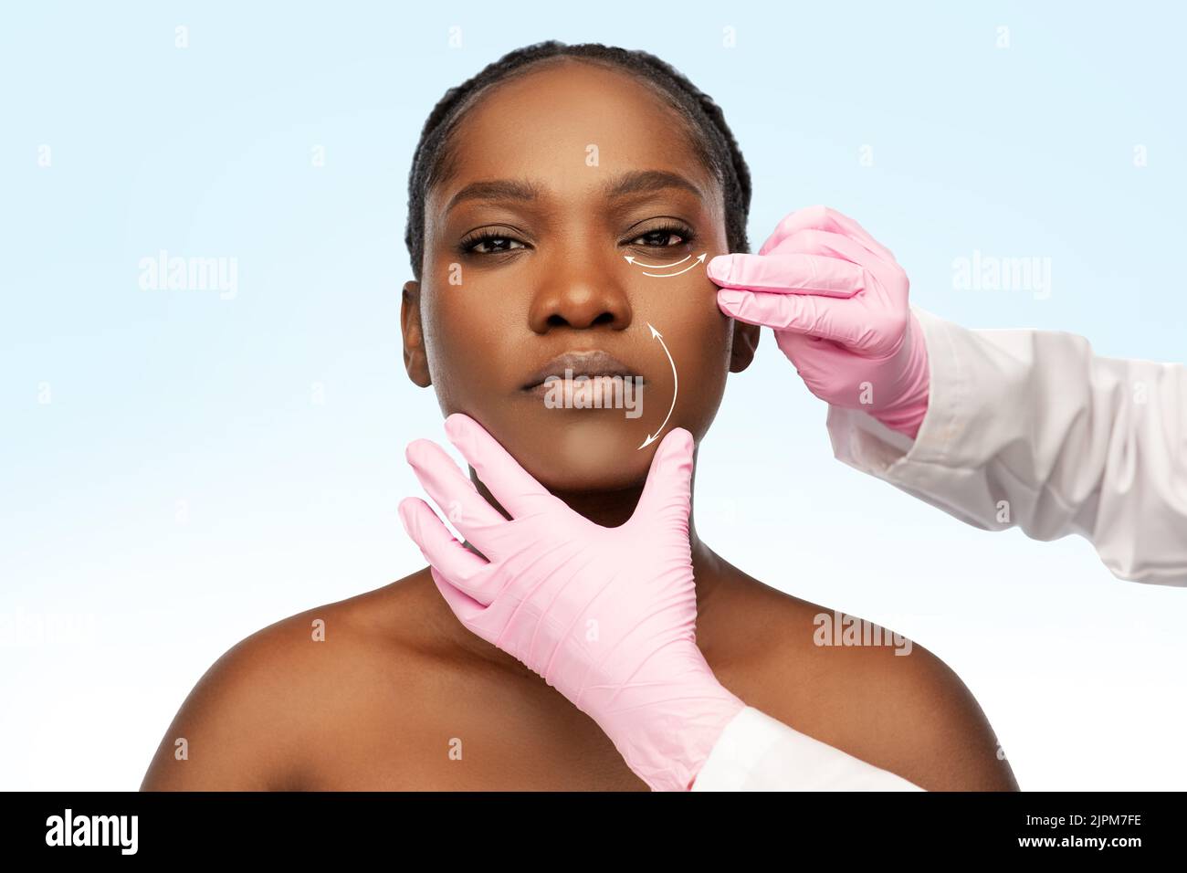 african american woman and plastic surgeon's hands Stock Photo