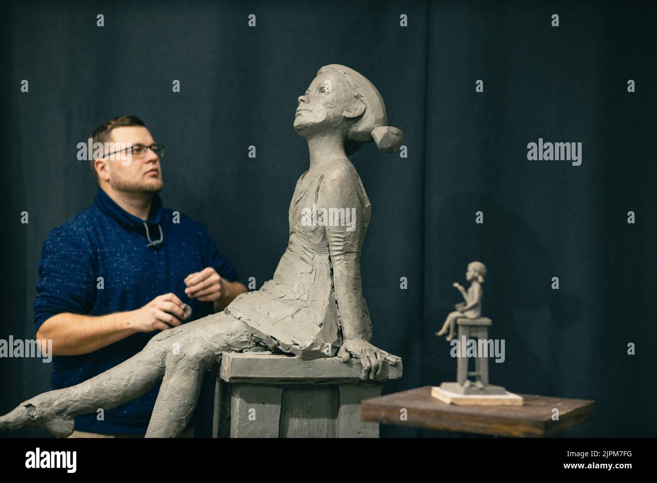 Woman modeling small hand statue hi-res stock photography and images ...