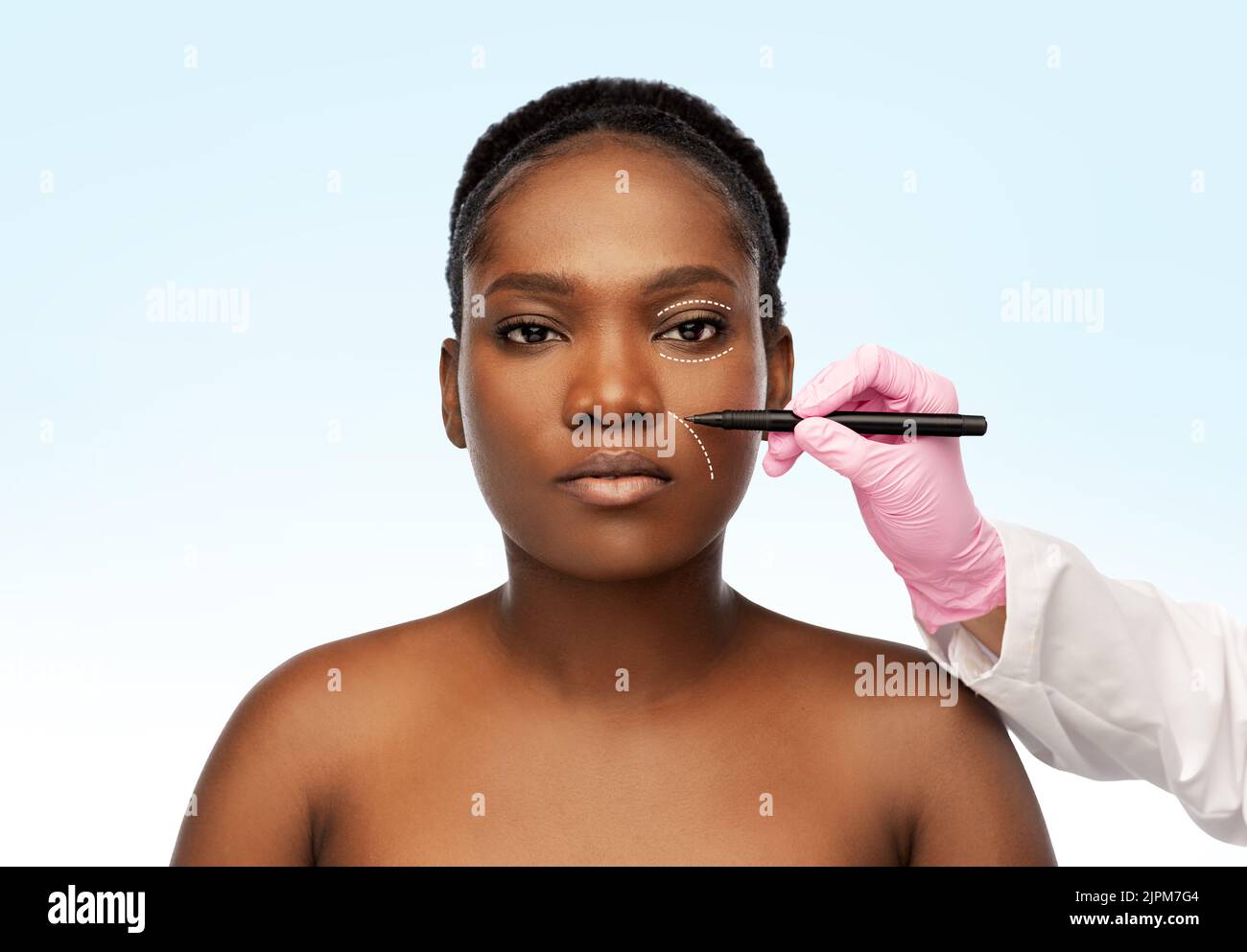 woman and plastic surgeon's hand with marker Stock Photo