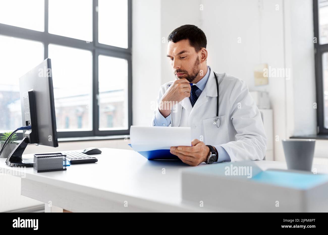 Stressed hispanic male doctor hi-res stock photography and images - Alamy