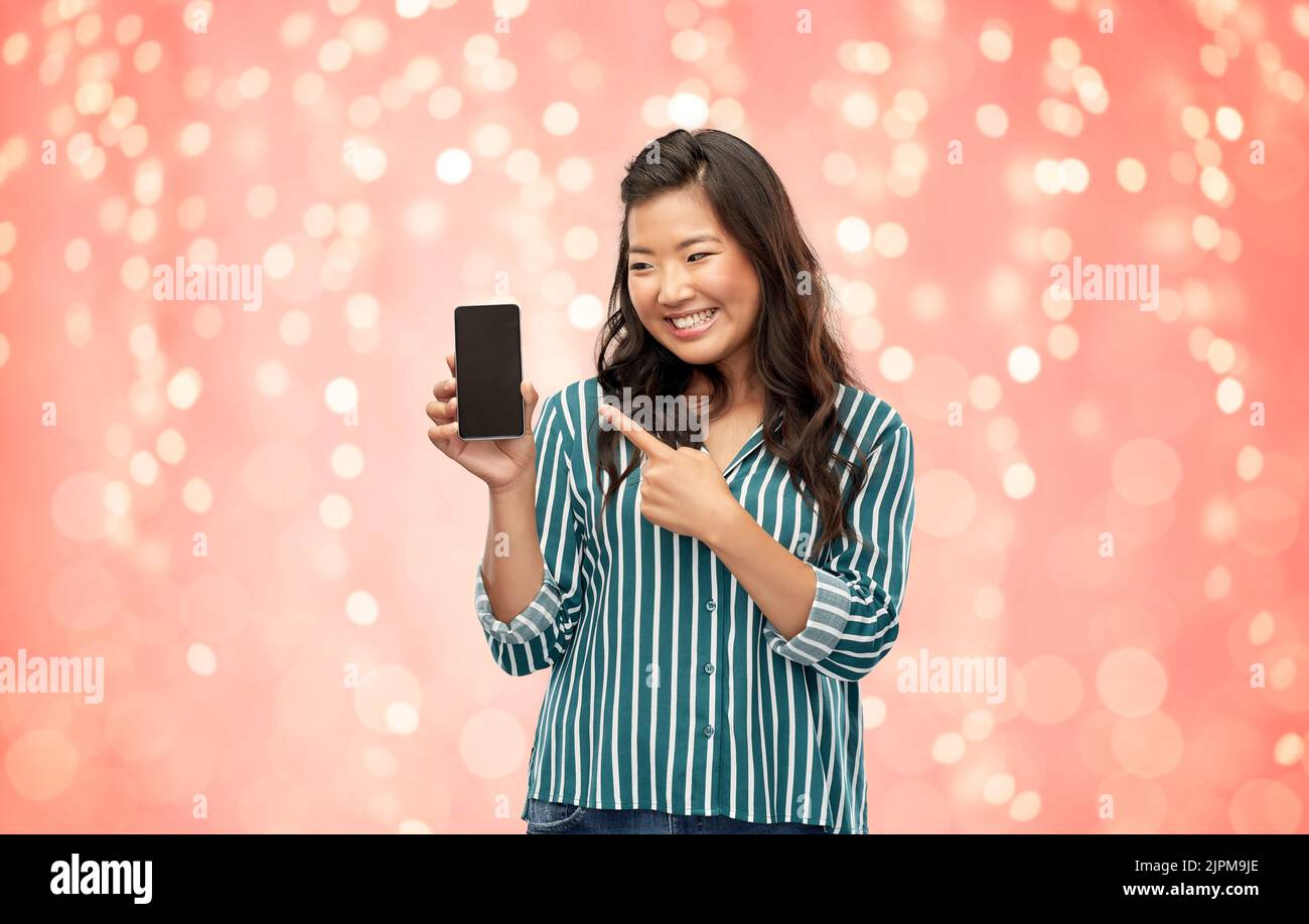 happy asian woman over grey background Stock Photo
