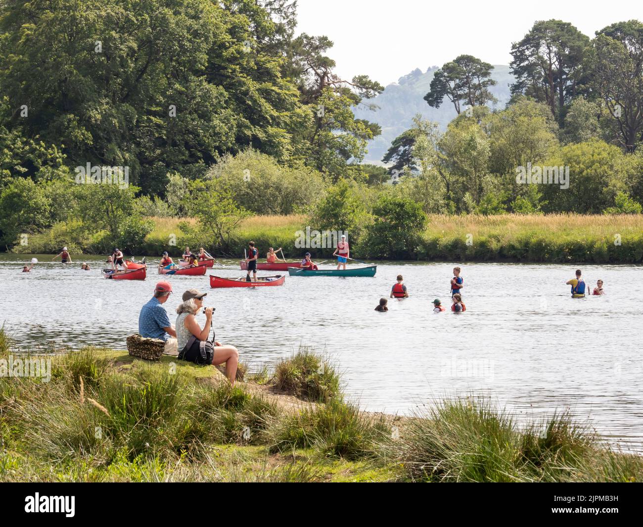 Crowds cool off in Lake Windermere in the mid July 2022 heatwave, when