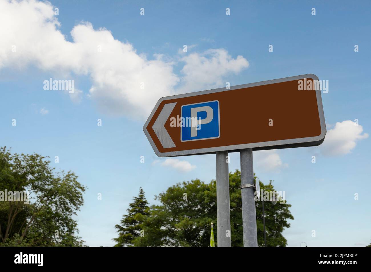 brown sign with blue parking sign copy space for your text Stock Photo ...