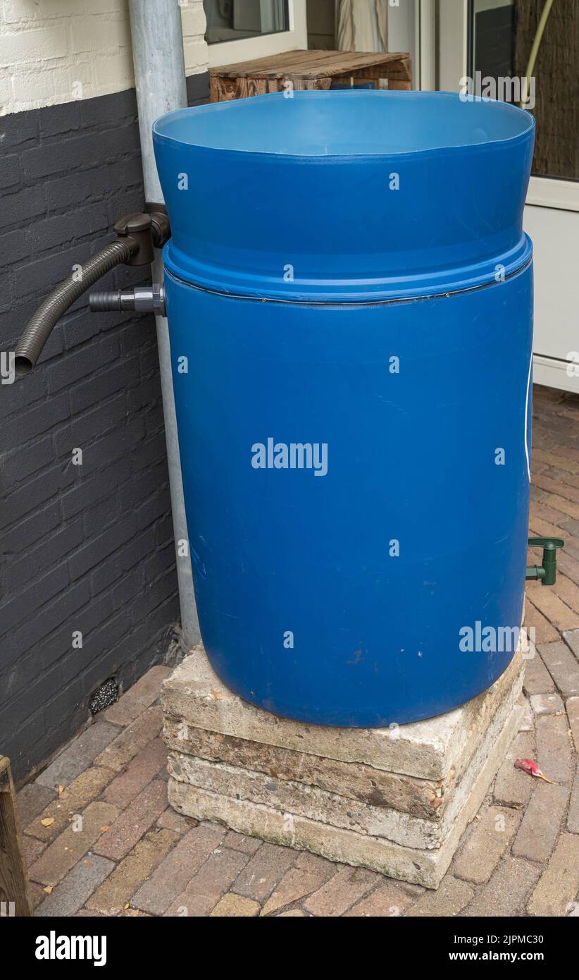 Rain barrel for rain water collection in process of installation