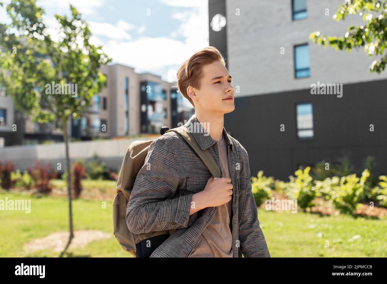 teenage student boy with backpack in city Stock Photo