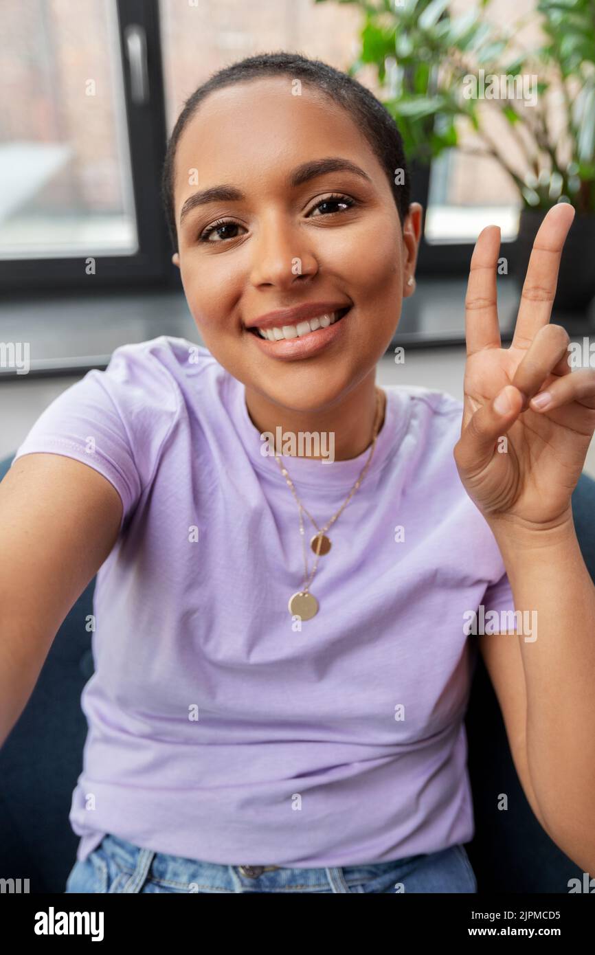 happy african american woman taking selfie at home Stock Photo - Alamy