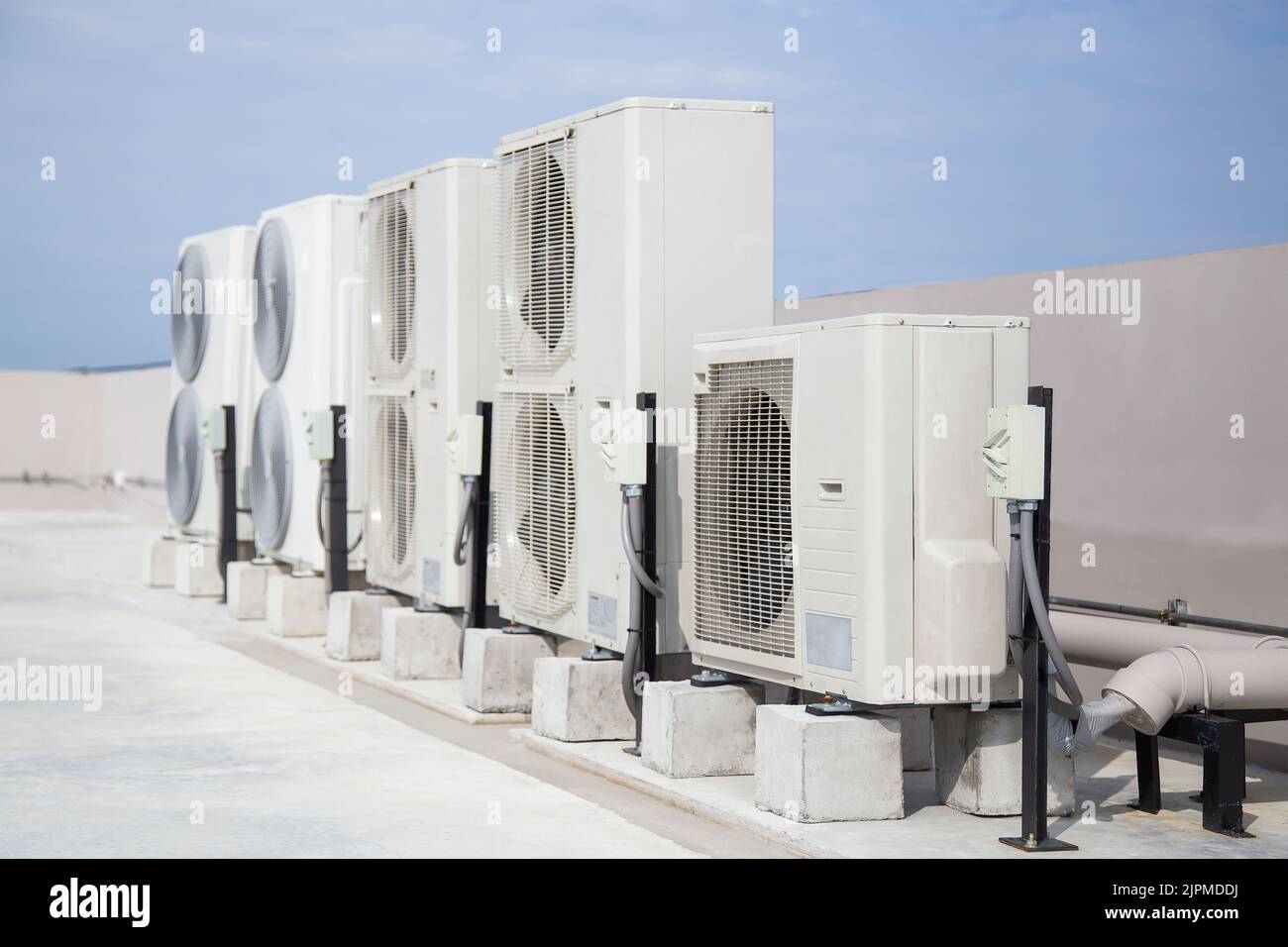 Air conditioning (HVAC) on the roof of an industrial building Stock Photo