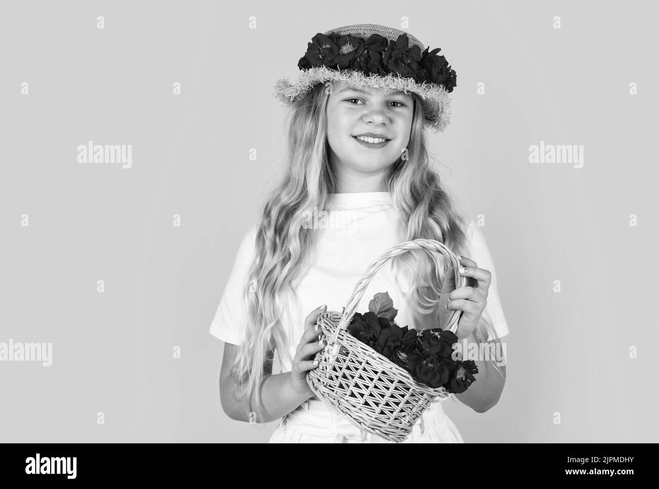 spring kid fashion. girl with rose flowers. girl with flower