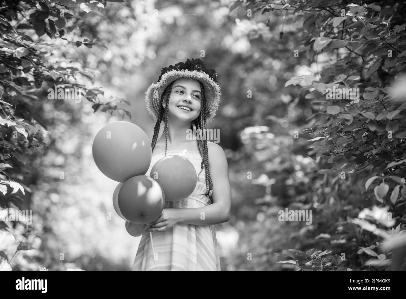 full of joy. spring kid fashion. girl with rose flowers. green nature
