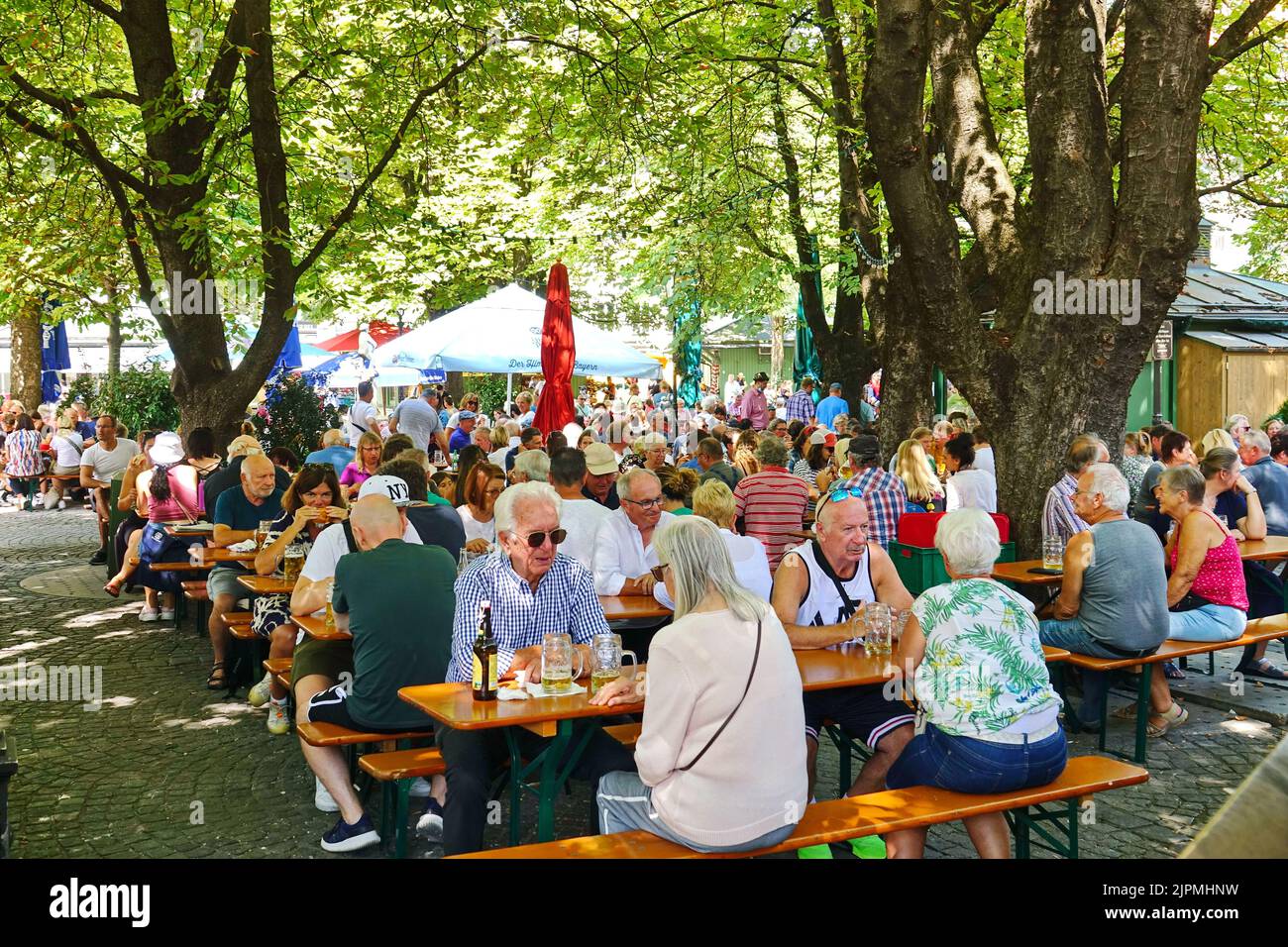 People at the Munich Viktualienmarkt. Munich's most famous permanent food market. Munich, GERMANY - August 2022 Stock Photo