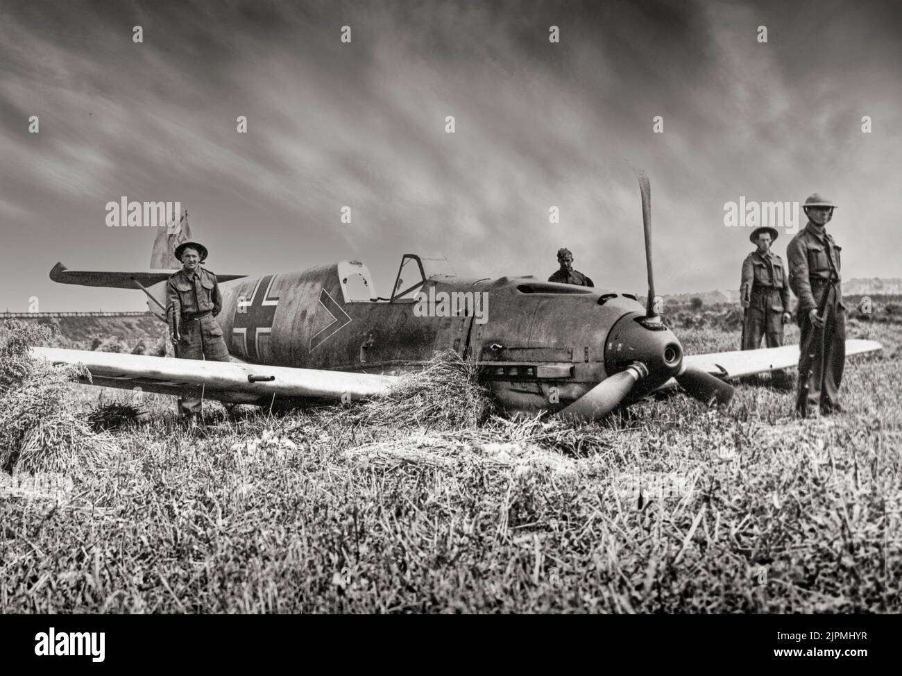 A Messerschmitt Bf 109 at Shoreham aerodrome in Sussex, England  1940 after crashing during the Battle of Britain. A German World War II fighter aircrafts, that along with the Focke-Wulf Fw 190, was the backbone of the Luftwaffe's fighter force. It was one of the most advanced fighters when it first appeared, with an all-metal monocoque construction, a closed canopy, and retractable landing gear. Stock Photo