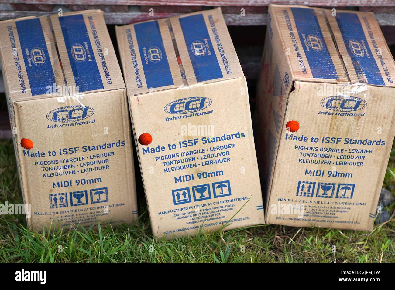 Boxes of clay pigeon discs made by CGI Stock Photo