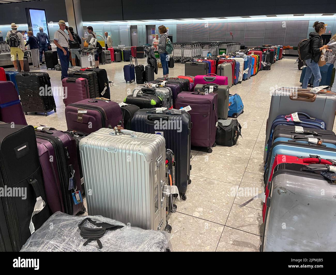 The picture dated August 17 2022 shows piles of uncollected suitcases at Heathrow Airport as the airport chaos continues Stock Photo